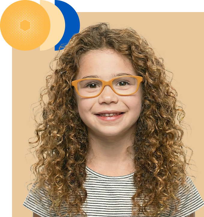A smiling girl with curly hair wearing amber-framed spectacles