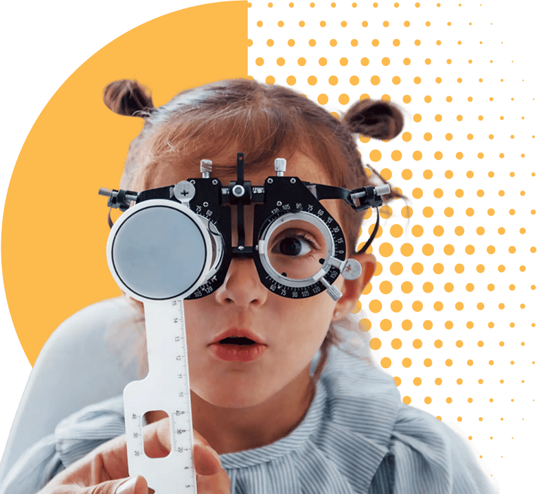 A young girl looking through a trial lens frame during an eye examination